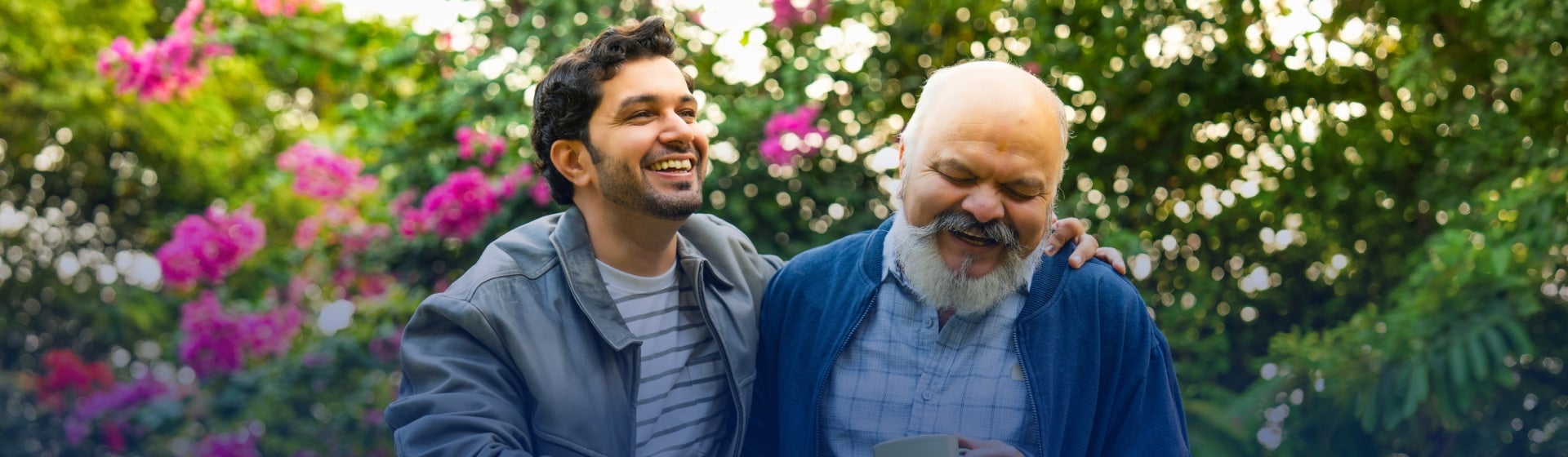 Adult son and his father happy outside, estate planning